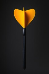 Yellow dart on a black background captures the essence of precision and focus in game strategy and competition with a minimalist style and a dark mood