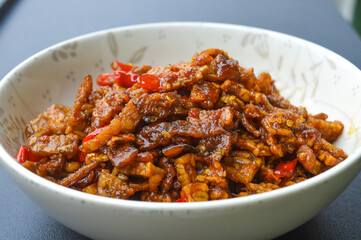 dish from indonesia kering tempe , made from tempe or soybeans cut into small pieces, cooked with chilies and soy sauce and other spices, tastes good and spicy