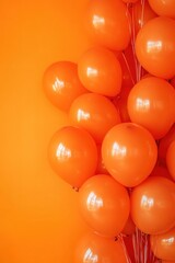 Festive orange balloons on a vibrant background creating a cheerful and celebratory atmosphere perfect for birthdays parties and special events with a modern and minimalist style