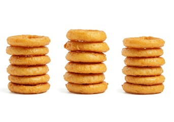 Stacks of glazed donuts on a white background, arranged in three columns