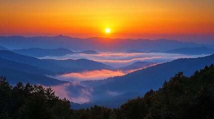 Obraz premium Sunrise Over Mountain Range with Foggy Valley Landscape