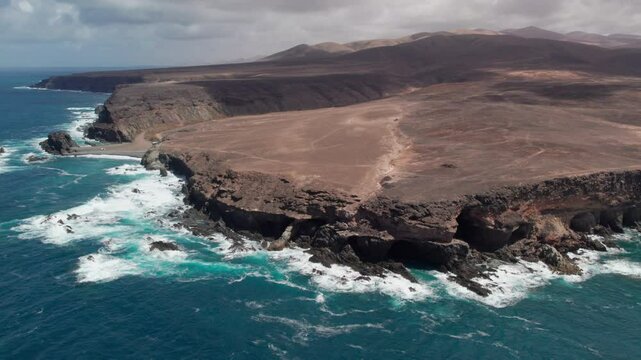 Discovering the coast of Fuerteventura and the Ajui Caves from the air, a stunning natural setting in the Canary Islands, Spain.