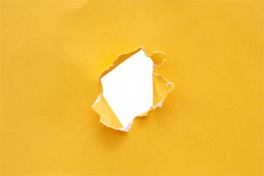 Torn ripped yellow paper hole isolated on white background