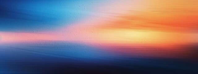 Fototapeta premium abstract blurred background with smooth gradient colors transitioning from blue and purple tones to warm orange and yellow hues, evoking a calm and serene atmosphere