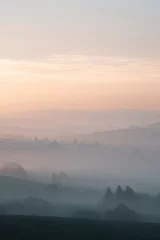 Tableau sur plexiglas Brume matinale vast expanse of dense morning fog blankets serene landscape obscuring details in distance  © Сергей Захаров