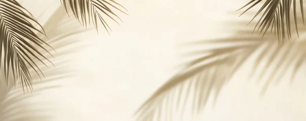 Fototapete Badezimmer Subtle shadows of palm leaves on a light beige surface.  © kirania