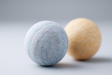 two objects with contrasting colors positioned on neutral clean background offering ample copy space