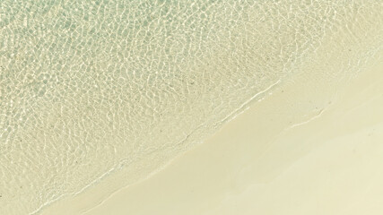 Nature of the beach and sea Summer with sunshine, sandy beaches, clear blue waters sparkling against the blue sky. On an island with good ecology and environment Background for summer vacation