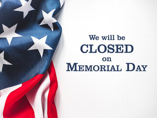 We will be closed on Memorial Day. American Flag and sign board with the inscription. Closeup, no...