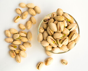 Roasted pistachios on white background