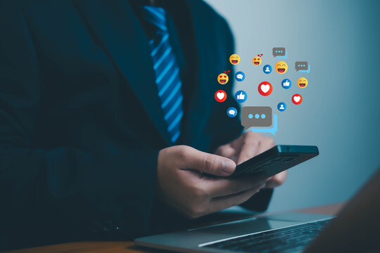 Social media and digital online, man using smart phone use social media network application, Friend reply chat concept or send emoticon for react feeling, playing Social media Distancing.