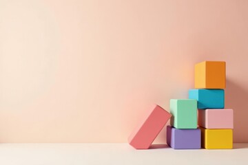 Pastel-colored blocks arranged against a soft pink backdrop, creating a minimalist and playful composition perfect for design inspiration or product display.