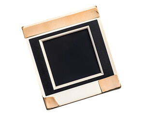 Vintage Photo Slide: A close-up shot of an antique photo slide, featuring a worn, off-white mount with copper-toned corner reinforcements, a dark central space ready for image insertion.