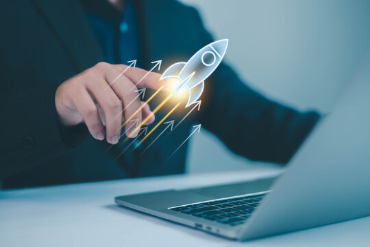 Business startup plan concept, Start plan and strategy step the growing, A businessman is pointing at a rocket taking off into the sky, digital marketing, network connection