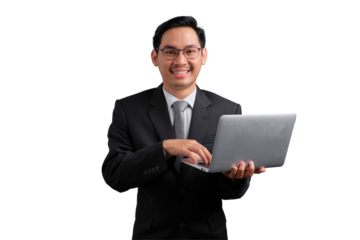 Smiling Asian businessman in suit holding and using laptop, isolated on transparent background