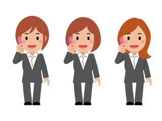 スマホで電話するグレースーツの若い女性