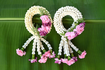 Fresh jasmine garland on banana leaves