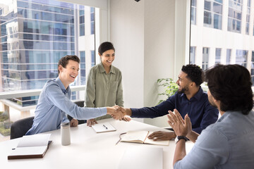 Fototapeta premium Motivated team members handshake, start or accomplish formal meeting in conference room, concluding successful agreement or partnership, express mutual respect, thanking for professional collaboration