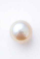 white pearl is sitting on a white surface