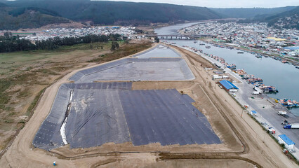 Geomembrane deployment and installation process with machinery in the construction of water pools