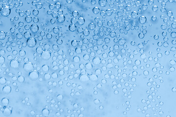 Soda water with bubbles as background, closeup
