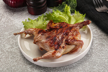 Grilled quail in the plate