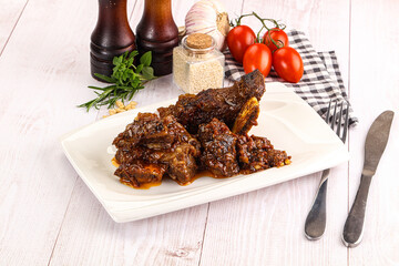 Prepared tasty beef ribs with sauce