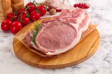 Raw potk loin steak with bone
