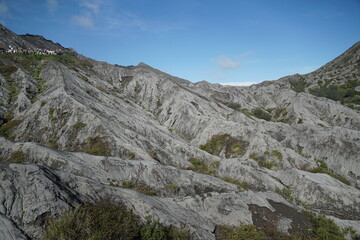 Expansive grey terrain formations natural landscape earthy environment scenic viewpoint geological concept