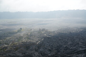 Volcanic eruption aftermath nature reserve aerial view desolate landscape foggy environment environmental impact