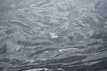 Fototapeta premium Volcanic eruption aftermath mountain range aerial view ashy landscape nature's power on display