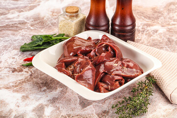 Raw uncokked chicken liver in the bowl
