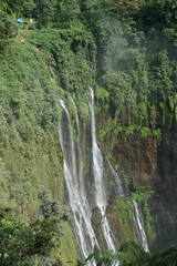 Majestic waterfall cascade remote forest nature photography lush green environment aerial view tranquil beauty
