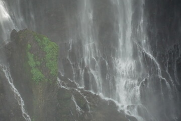 Cascading waterfall adventure natural wonder aerial photography misty environment serene viewpoint nature's majesty