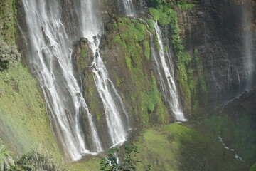 Cascading waterfalls nature paradise scenic view lush greenery aerial perspective breathtaking landscape photography