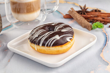 Delicous sweet donut with chocolate glaze