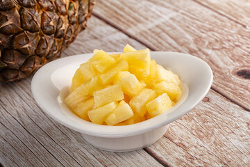 Sweet canned pineapple fruit pieces