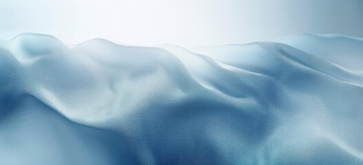 Smooth light blue silky fabric with gentle folds and waves creating a soft and calming texture and an elegant flowing appearance