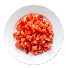 Chopped tomatoes cubes in plate isolated on transparent background