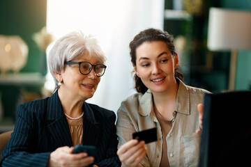 women are using laptop for online shopping