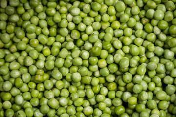 Heap of Green Peas for sale in the market of Tanzania, close up view for background use.