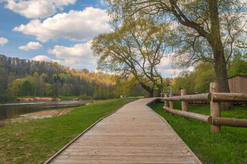 Wooden boardwalk along the Gauja River in Sigulda, Latvia.