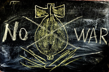 The poster has a bomb drawn on a black background and the words, no to war. The bomb is crossed out with two lines.