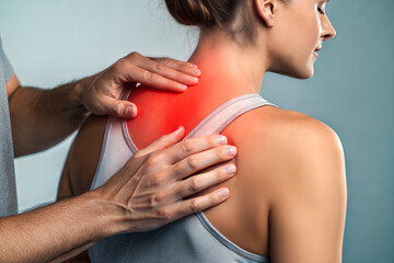 A close-up of a physiotherapist gently massaging a woman's upper back, highlighting the area of discomfort with a red overlay.