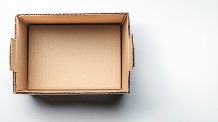 Fototapeta premium Empty cardboard box on white surface packaging clean and minimalist environment top view