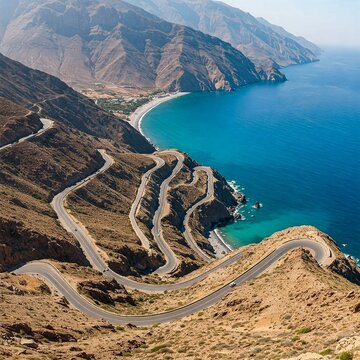Winding roads of Makran Coastal Highway embrace deep blue seas and rugged mountains, weaving a dreamlike scene for travelers.