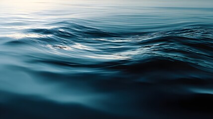 Naklejka premium Close-up of gentle ocean waves with soft reflections on calm blue water