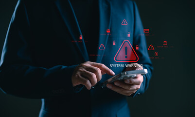 Businessman using smartphone facing system warning and cyber attack alert, representing cybersecurity risk, hacking threat, data breach, information security, and digital protection concerns.