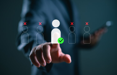 A businessman selects a highlighted person icon among others, symbolizing recruitment, candidate selection, target marketing, and strategic partnership decision-making.