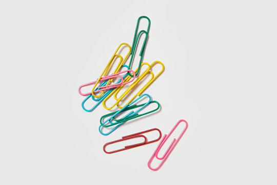 colorful paper clips on a white background